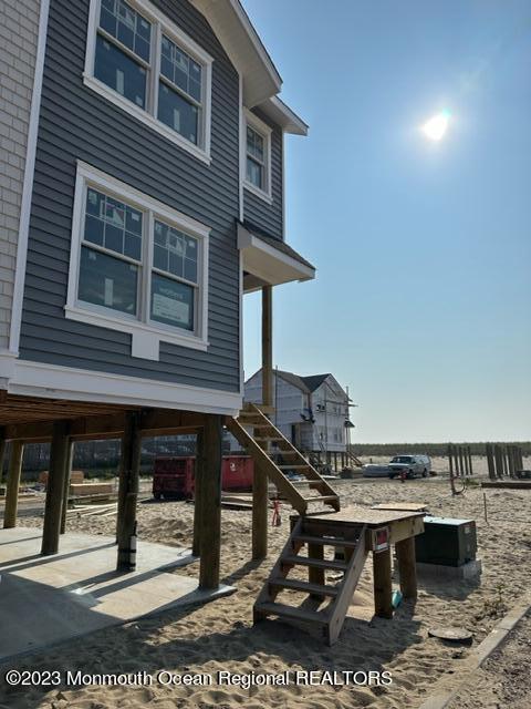 23 Shell Road, Unit 57 Mantoloking, NJ 08738 - Photo 4 of 17 a view of a chairs and table on the terrace