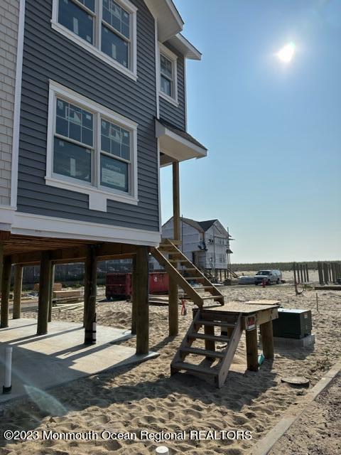 23 Shell Road, Unit 57 Mantoloking, NJ 08738 - Photo 5 of 17 a view of a house with a porch