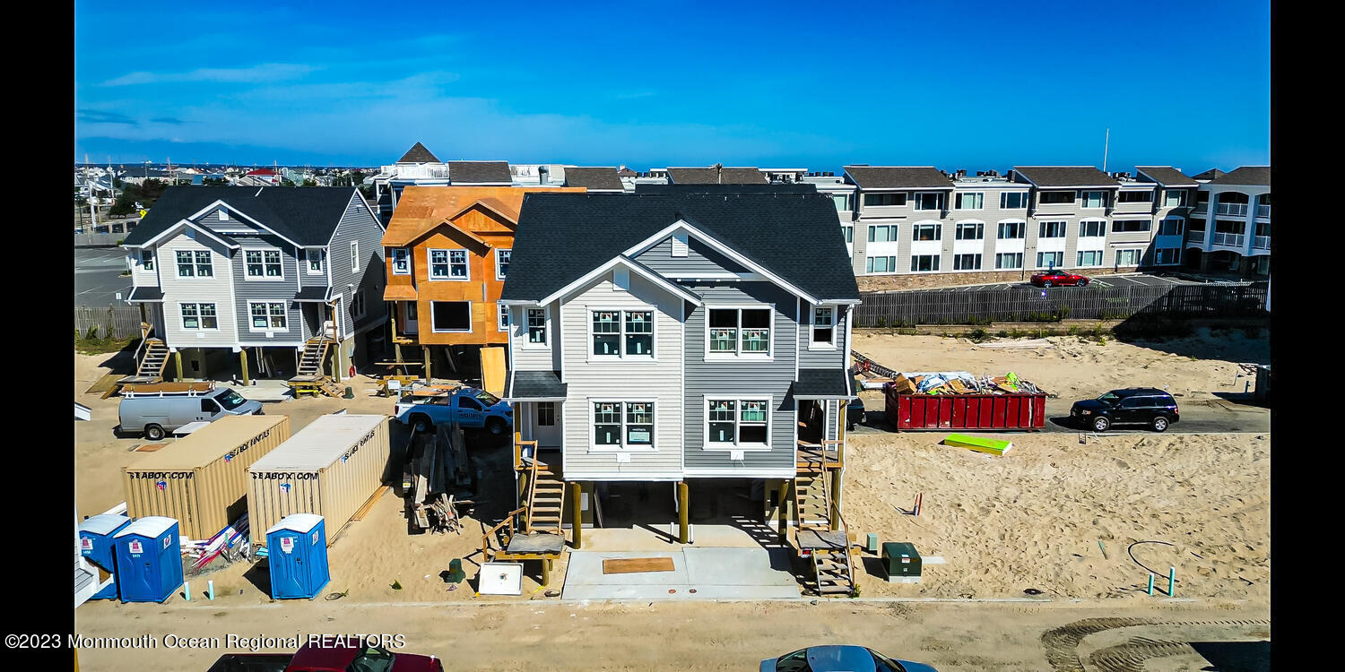 23 Shell Road, Unit 57 Mantoloking, NJ 08738 - Photo 7 of 17 a view of multiple houses with a street