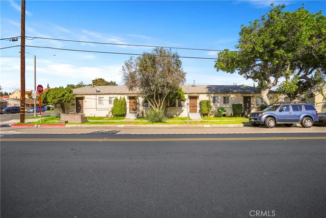a view of a parked cars in front of a house