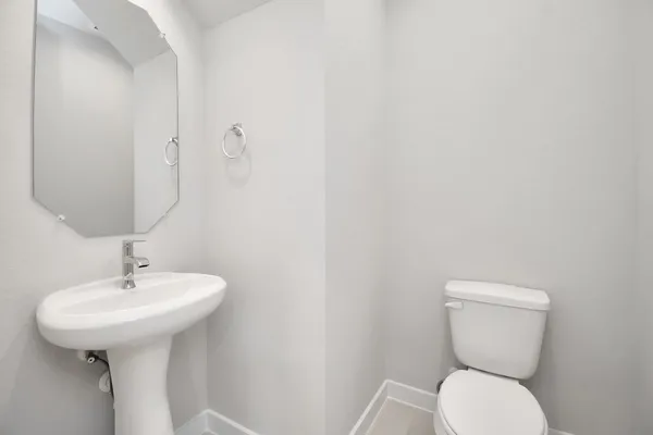 a kitchen with granite countertop a sink stainless steel appliances and cabinets