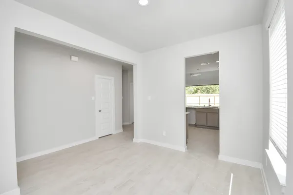 a view of kitchen with stainless steel appliances refrigerator oven and cabinets