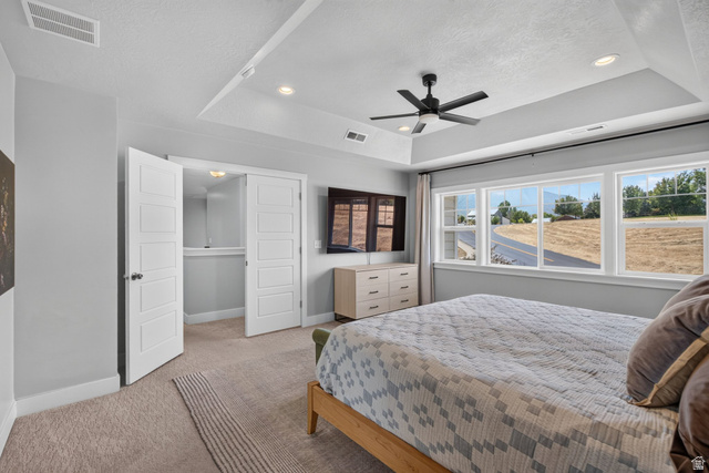 1263 East 1200th South Springville, UT 84663 - Photo 15 of 60 Tray ceiling with recessed lighting and a ceiling fan