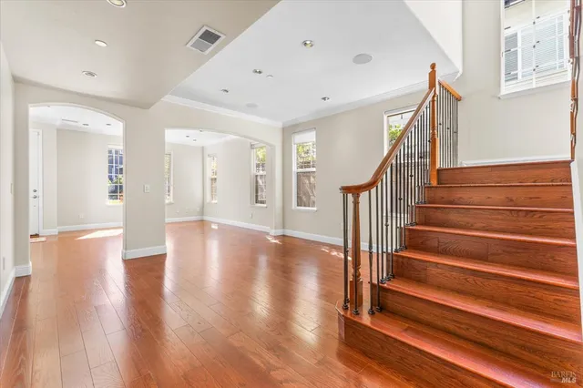 a view of an entryway with wooden floor