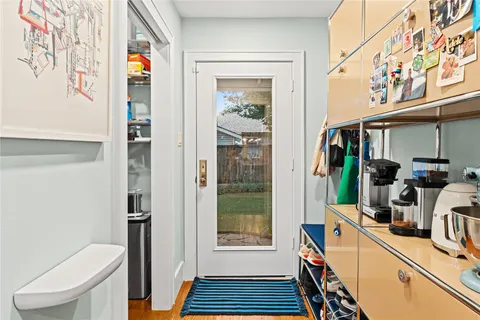a kitchen with sink and refrigerator