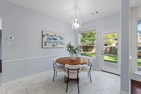 a bathroom with a sink double vanity granite and a mirror