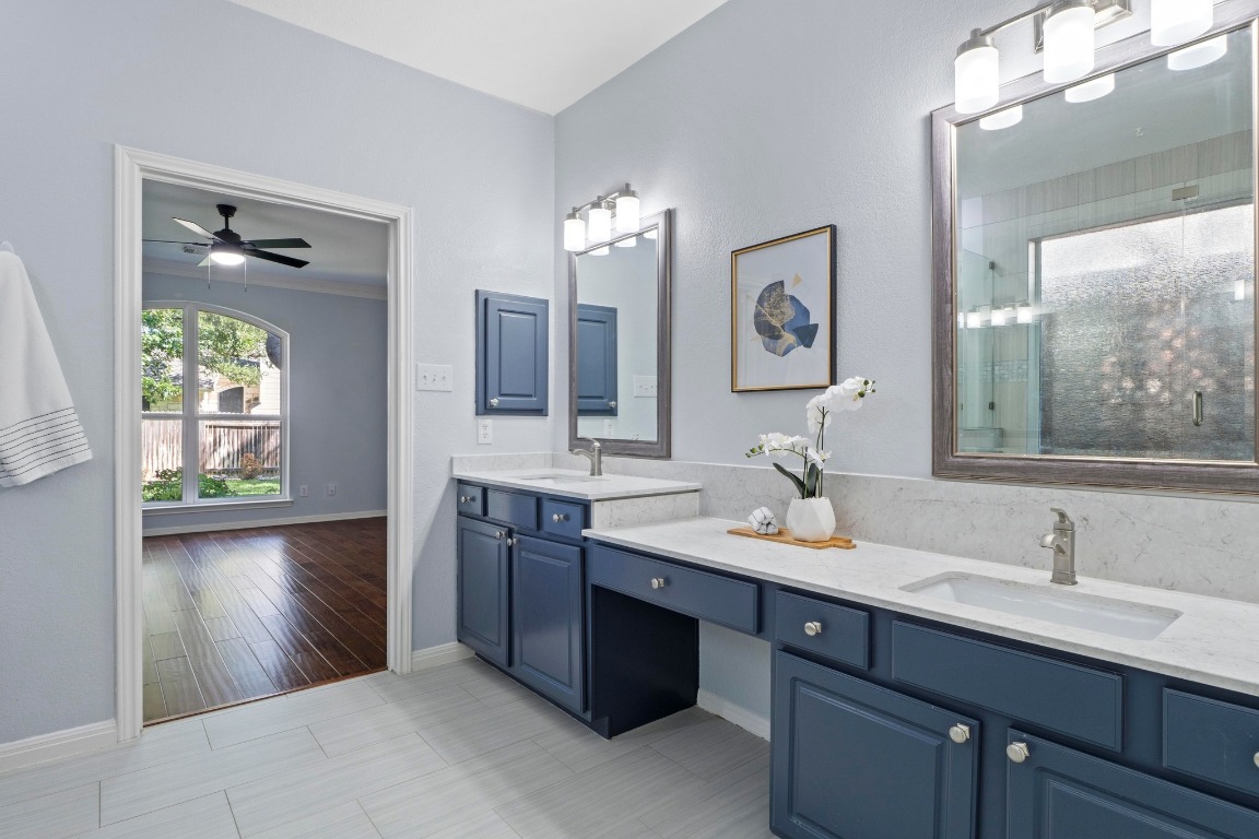 1601 Michael Robert Way Cedar Park, TX 78613 - Photo 17 of 35 a bathroom with a sink double vanity granite and a mirror
