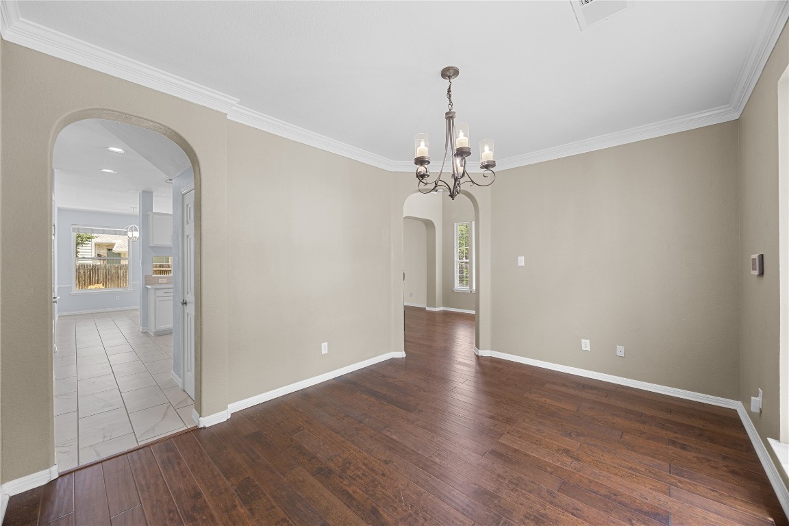 1601 Michael Robert Way Cedar Park, TX 78613 - Photo 19 of 35 a view of an empty room with wooden floor