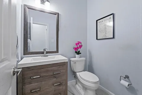 a bathroom with a sink a shower and a mirror
