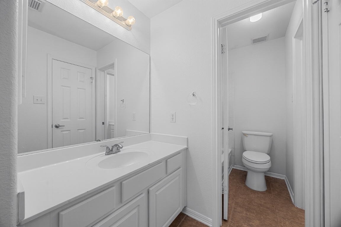 1601 Michael Robert Way Cedar Park, TX 78613 - Photo 26 of 35 a bathroom with a sink toilet and a mirror