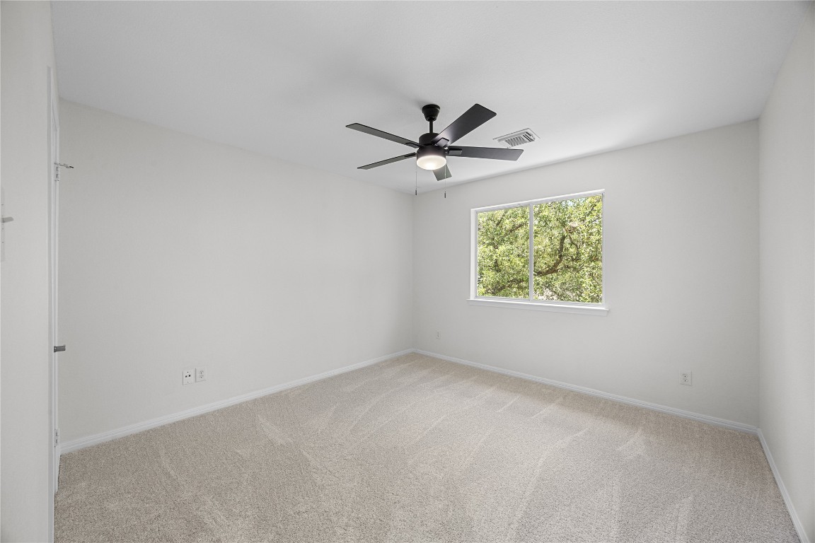 1601 Michael Robert Way Cedar Park, TX 78613 - Photo 27 of 35 an empty room with windows and ceiling fan