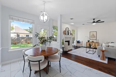 a bathroom with a sink double vanity granite and a mirror