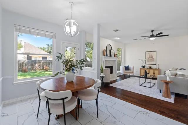 a bathroom with a sink double vanity granite and a mirror