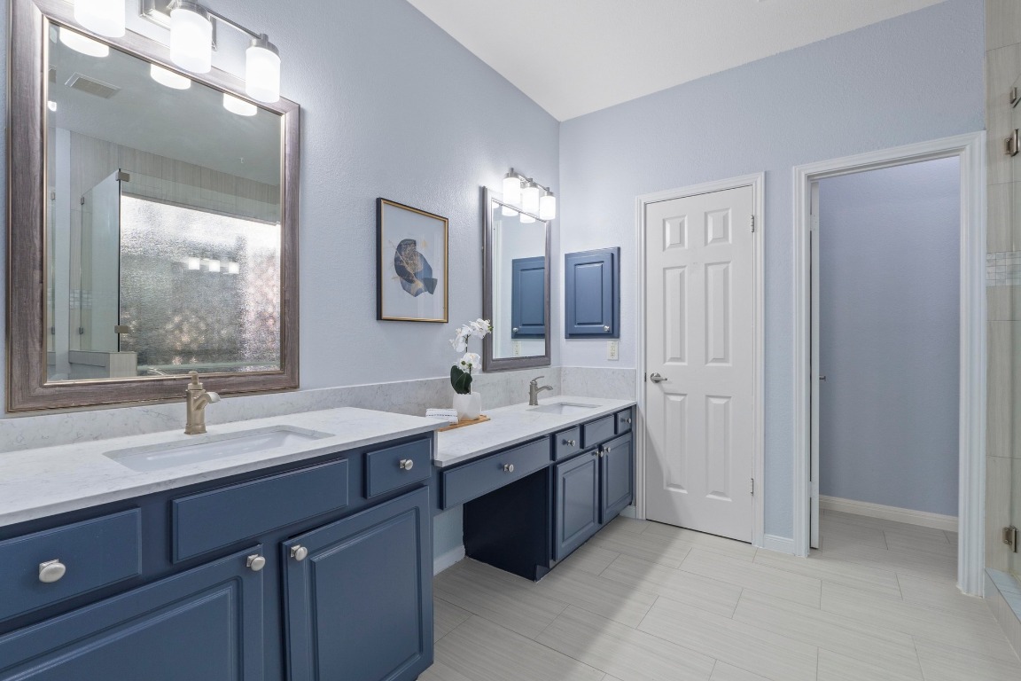 1601 Michael Robert Way Cedar Park, TX 78613 - Photo 4 of 35 a bathroom with a sink double vanity granite and a mirror