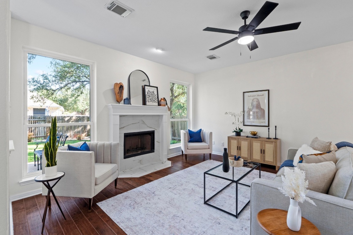 1601 Michael Robert Way Cedar Park, TX 78613 - Photo 6 of 35 a living room with furniture and a fireplace
