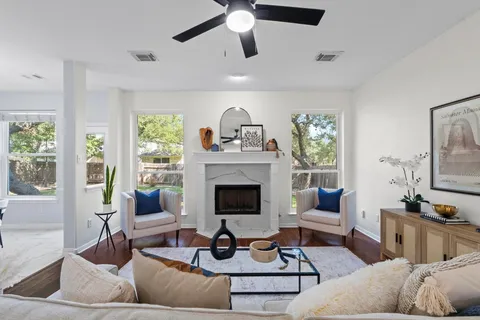 a living room with furniture and a fireplace