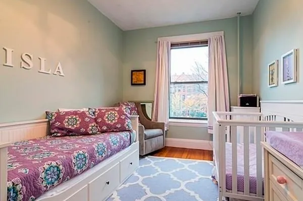 a living room with furniture and a rug