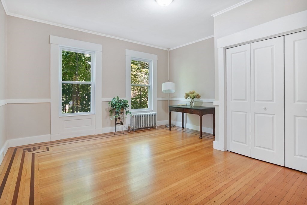123 Springfield Street Chicopee, MA 01013 - Photo 16 of 42 a view of an empty room with window and wooden floor