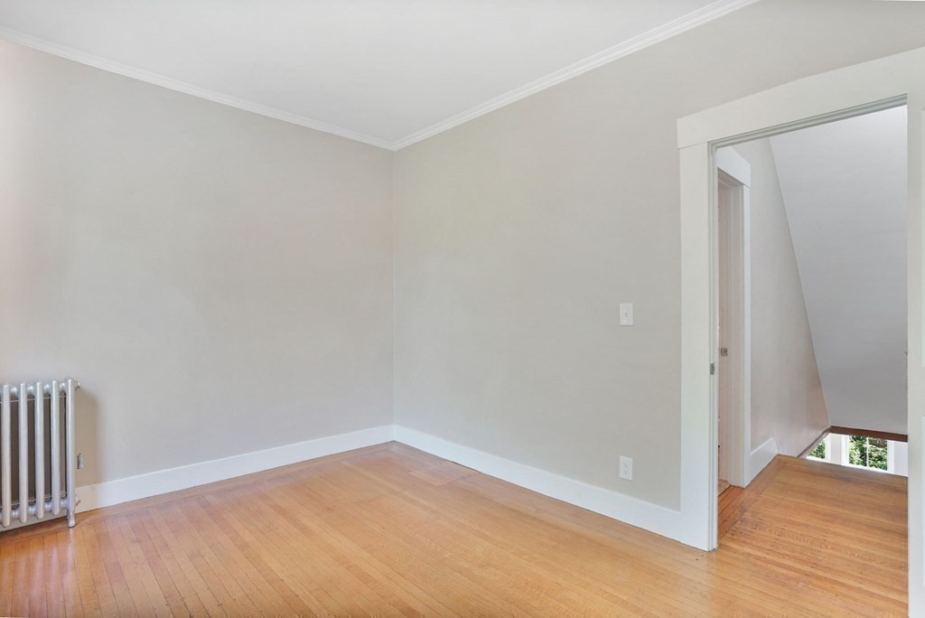 123 Springfield Street Chicopee, MA 01013 - Photo 20 of 42 a view of an empty room and wooden floor