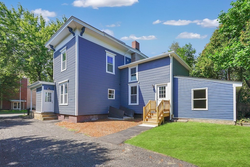 123 Springfield Street Chicopee, MA 01013 - Photo 2 of 42 a front view of a house with garden
