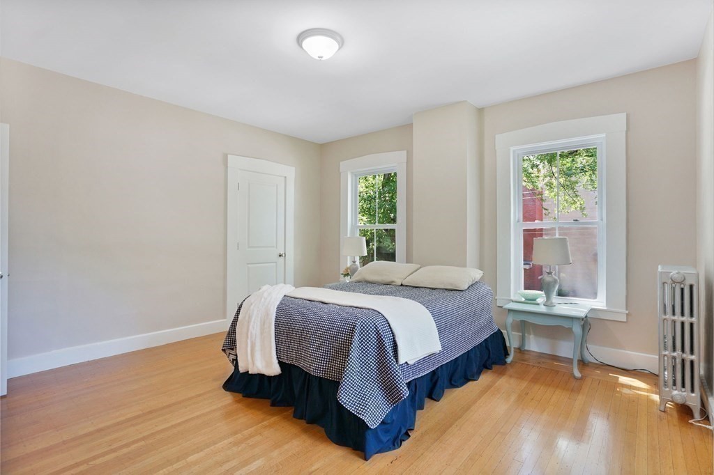 123 Springfield Street Chicopee, MA 01013 - Photo 22 of 42 a bedroom with a bed and windows