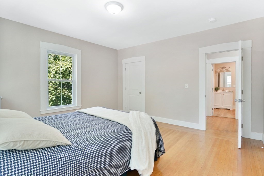 123 Springfield Street Chicopee, MA 01013 - Photo 23 of 42 a bedroom with a bed and a view of bathroom