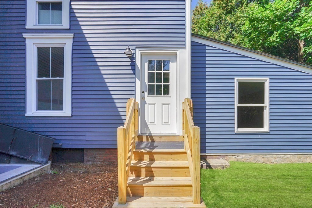 123 Springfield Street Chicopee, MA 01013 - Photo 29 of 42 a front view of a house with a yard