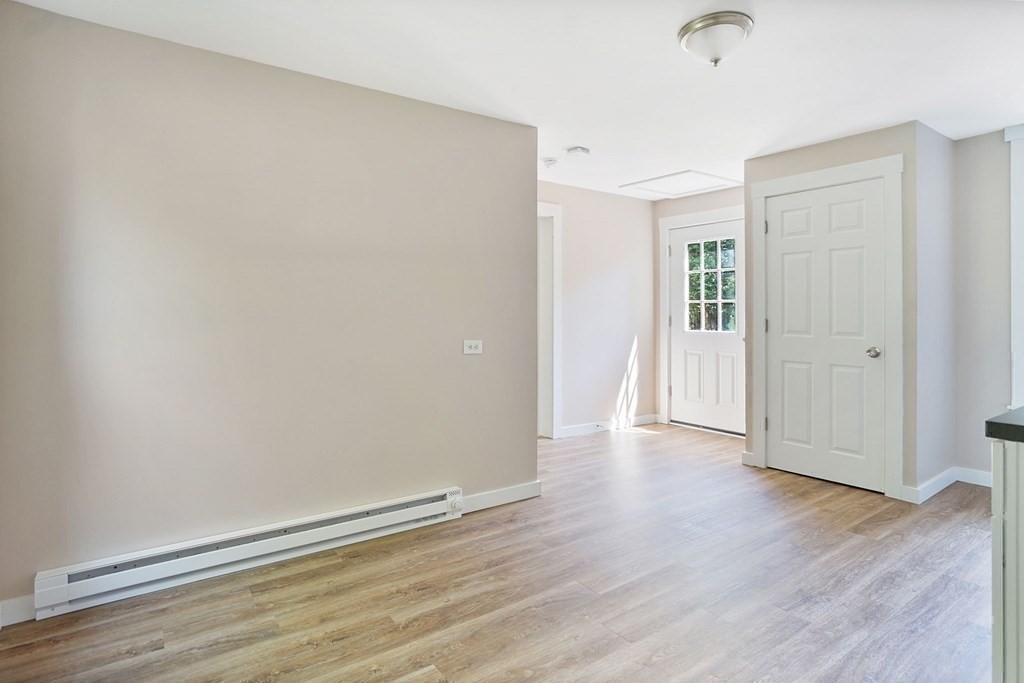 123 Springfield Street Chicopee, MA 01013 - Photo 30 of 42 an empty room with wooden floor