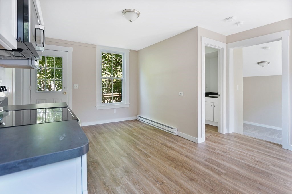 123 Springfield Street Chicopee, MA 01013 - Photo 33 of 42 a view of an empty room with window and wooden floor