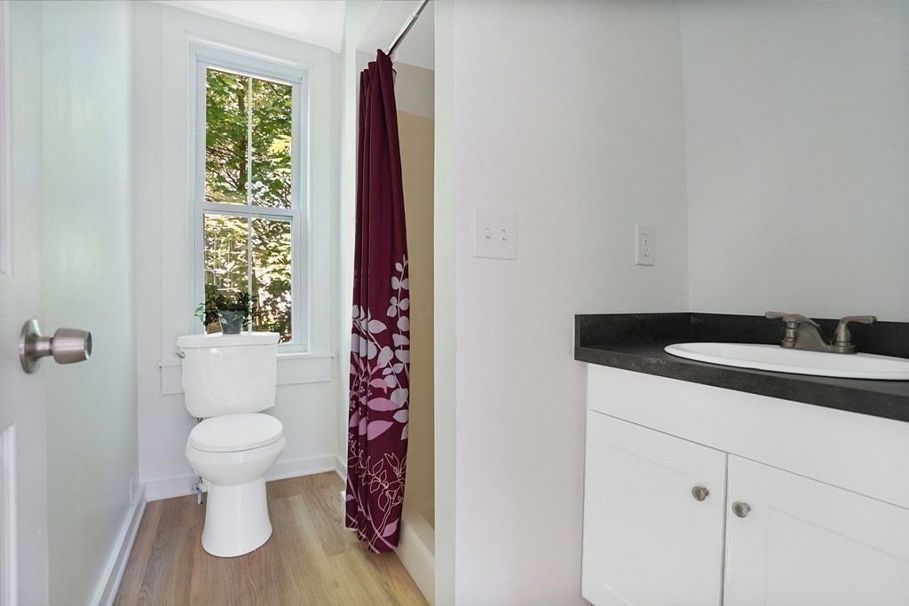 123 Springfield Street Chicopee, MA 01013 - Photo 35 of 42 a bathroom with a toilet sink and mirror