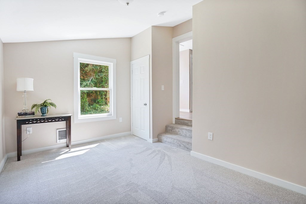 123 Springfield Street Chicopee, MA 01013 - Photo 36 of 42 an empty room with windows and cabinet