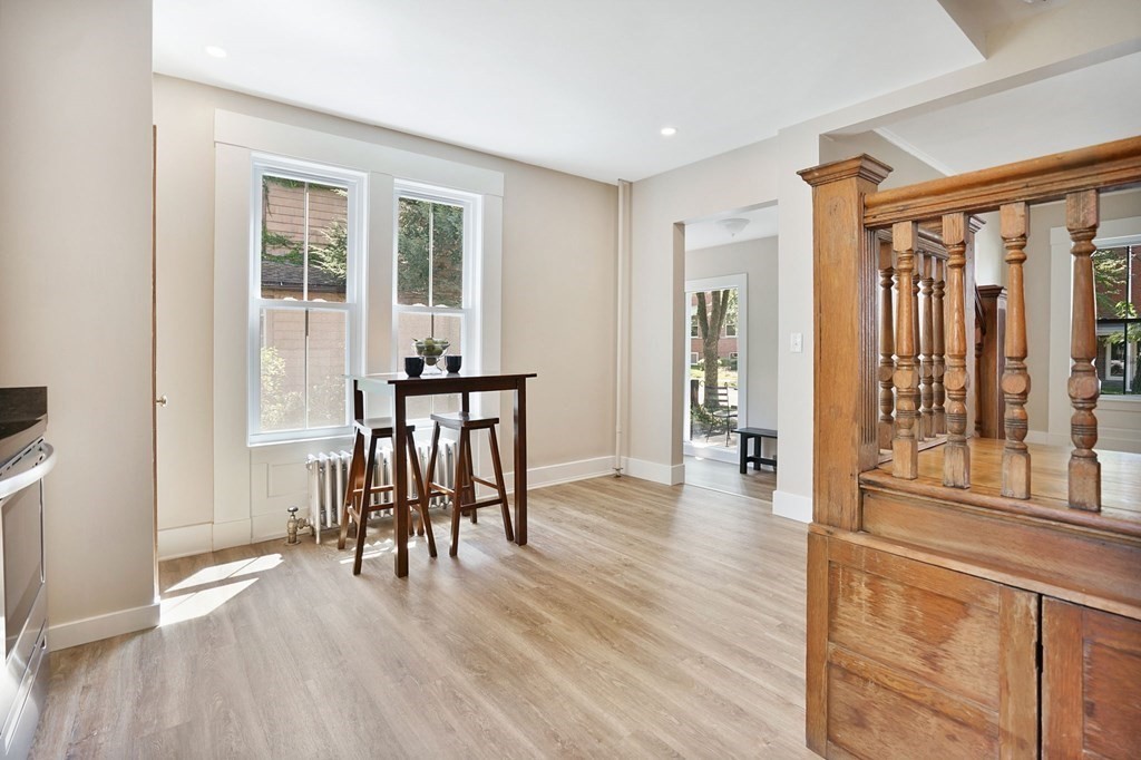 123 Springfield Street Chicopee, MA 01013 - Photo 6 of 42 a dining room with furniture and wooden floor