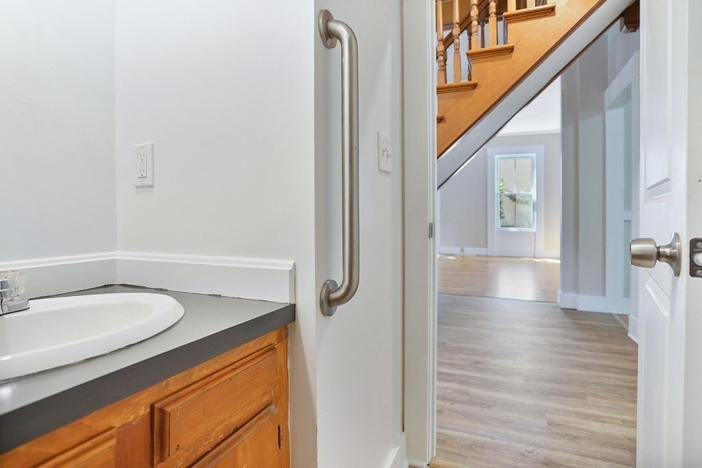 123 Springfield Street Chicopee, MA 01013 - Photo 10 of 42 a bathroom with a granite countertop sink and a mirror