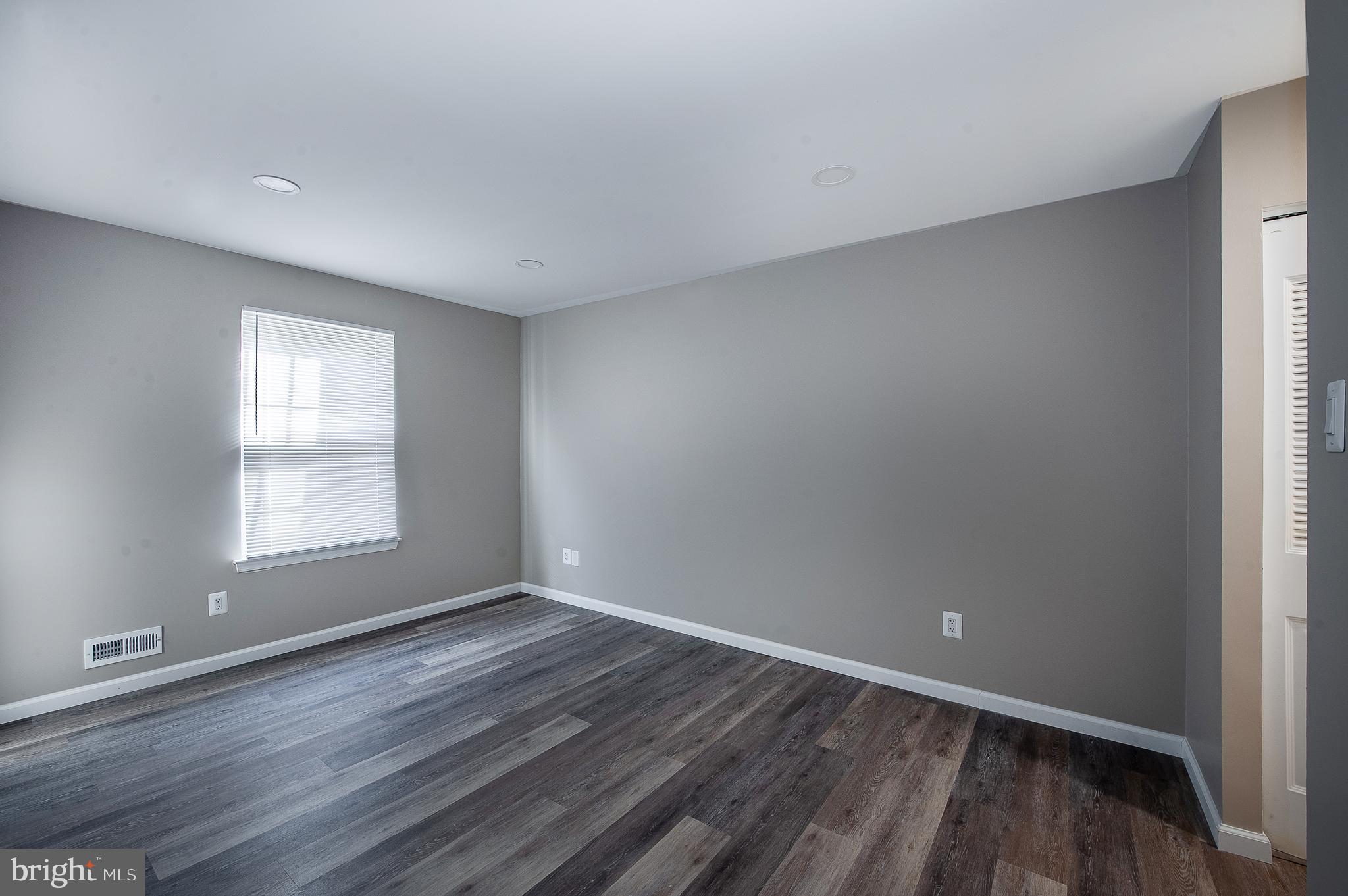 1010 Huntingdon Mews Clementon, NJ 08021 - Photo 15 of 19 wooden floor in an empty room with a window