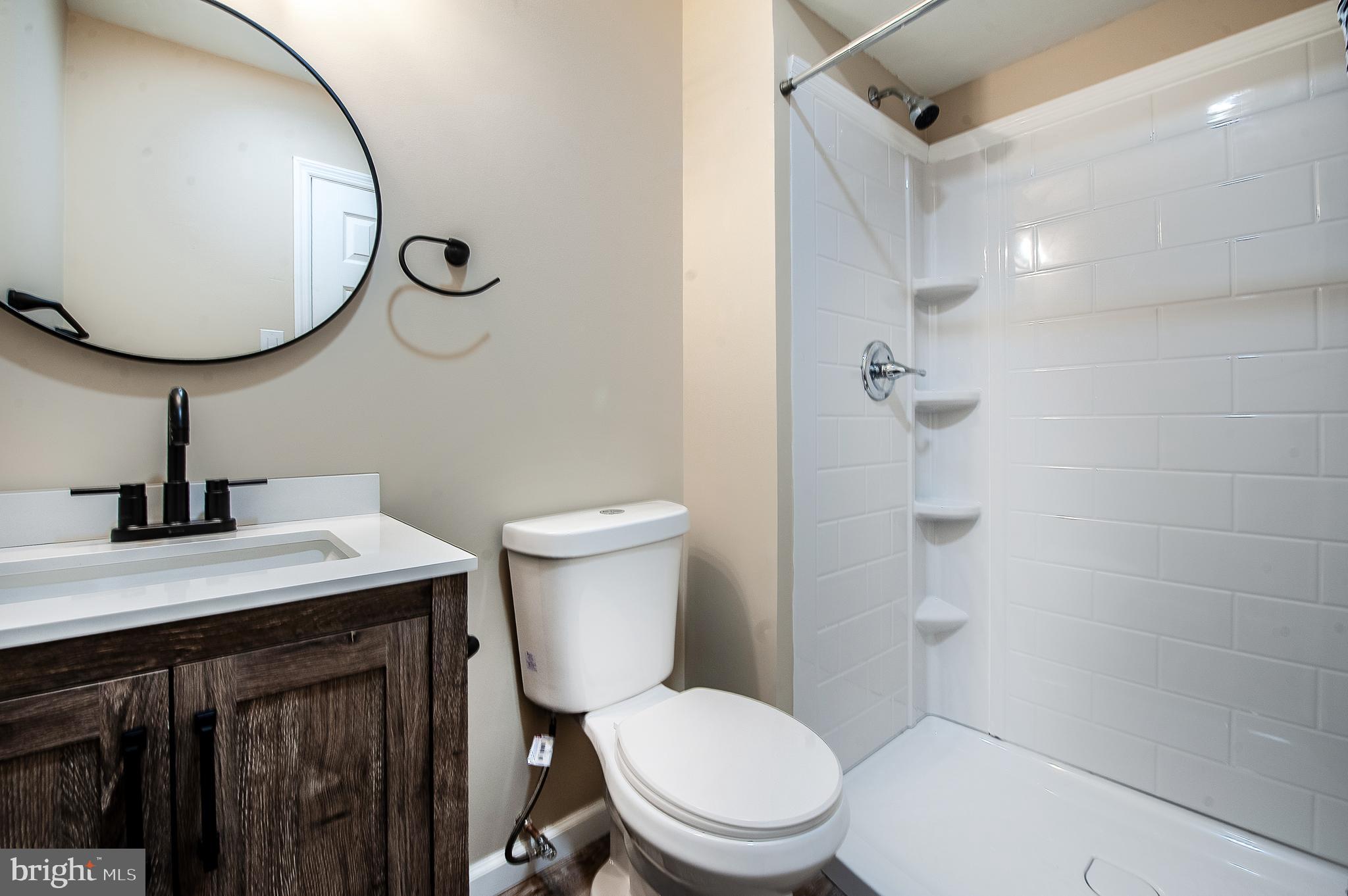 1010 Huntingdon Mews Clementon, NJ 08021 - Photo 16 of 19 a bathroom with a toilet a sink and mirror