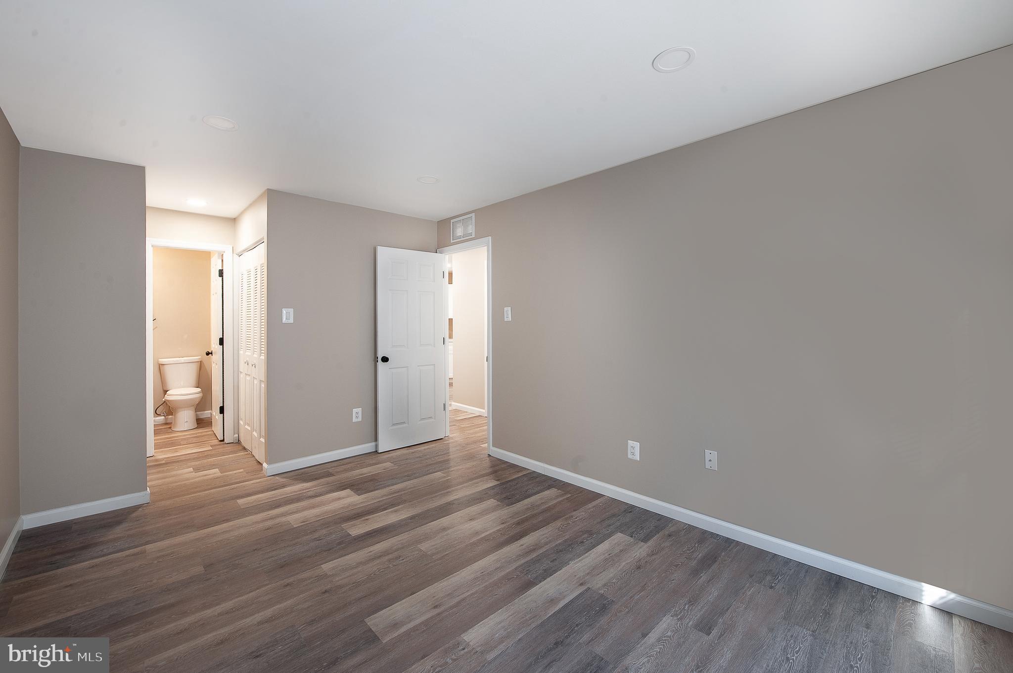 1010 Huntingdon Mews Clementon, NJ 08021 - Photo 17 of 19 a view of an empty room and wooden floor