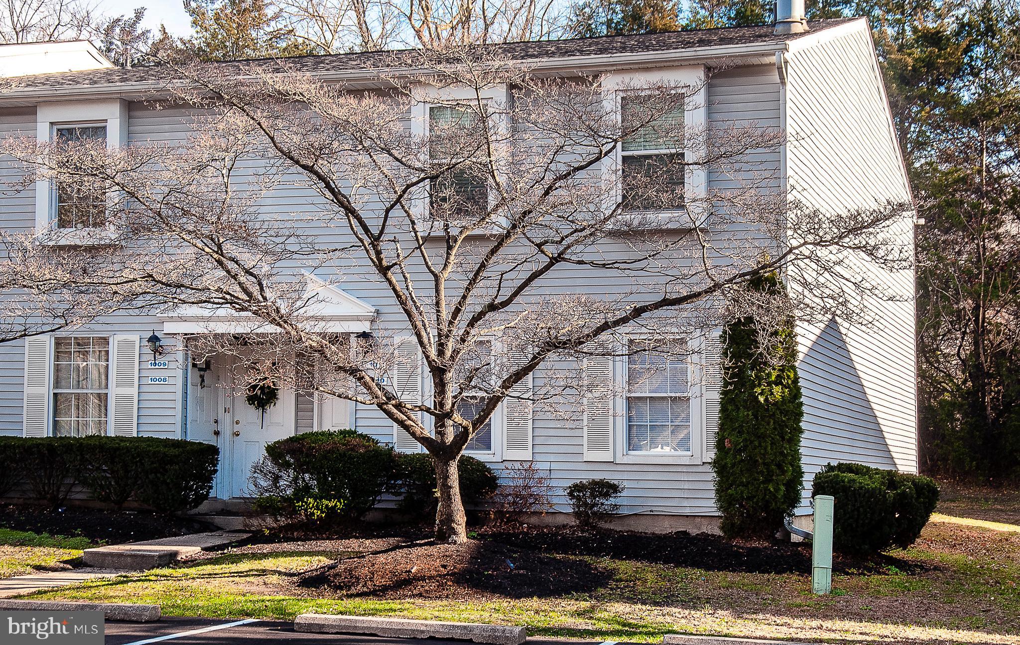 1010 Huntingdon Mews Clementon, NJ 08021 - Photo 18 of 19 a front view of a house with garden and trees