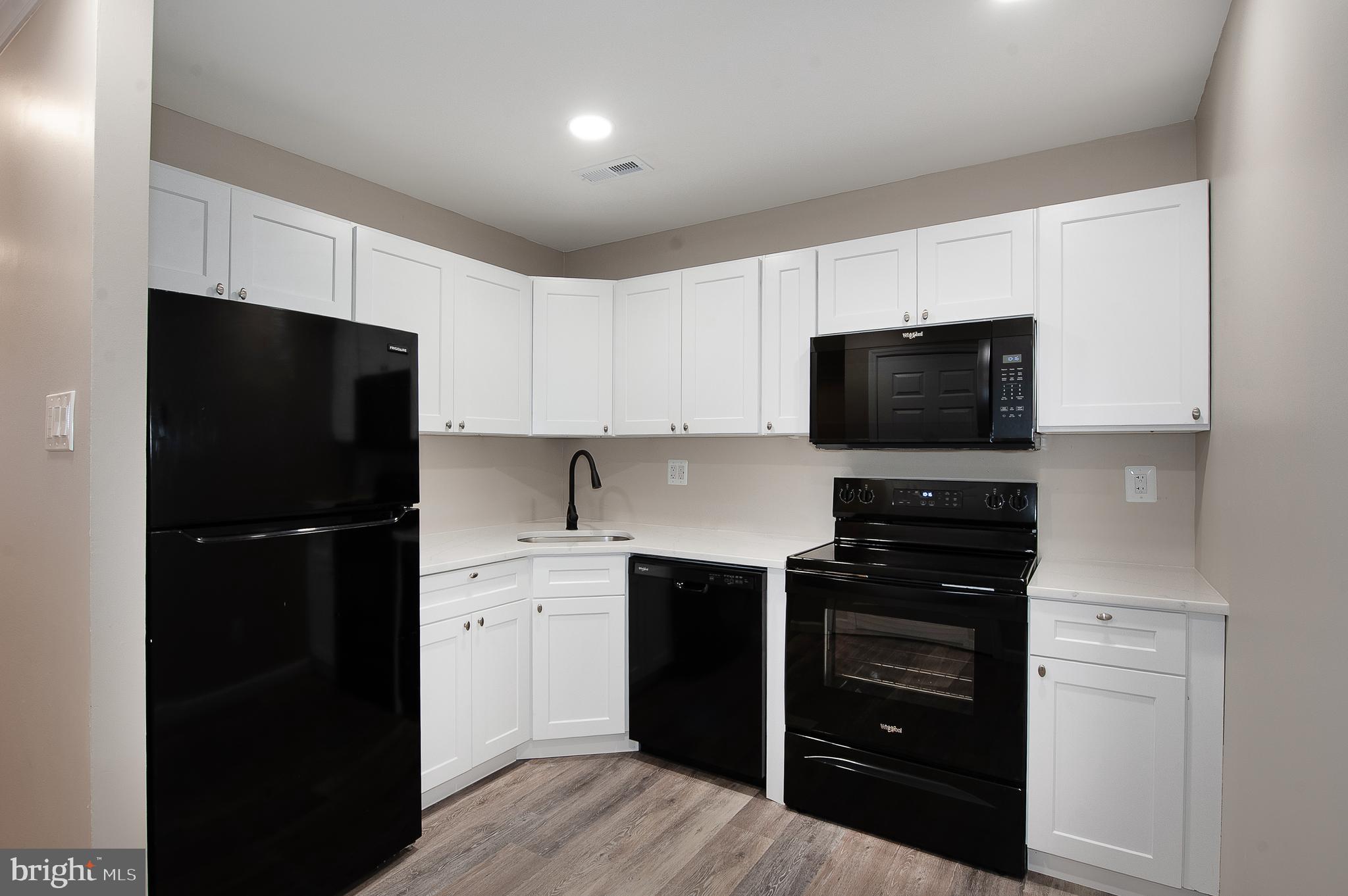 1010 Huntingdon Mews Clementon, NJ 08021 - Photo 6 of 19 a kitchen with a refrigerator stove and microwave