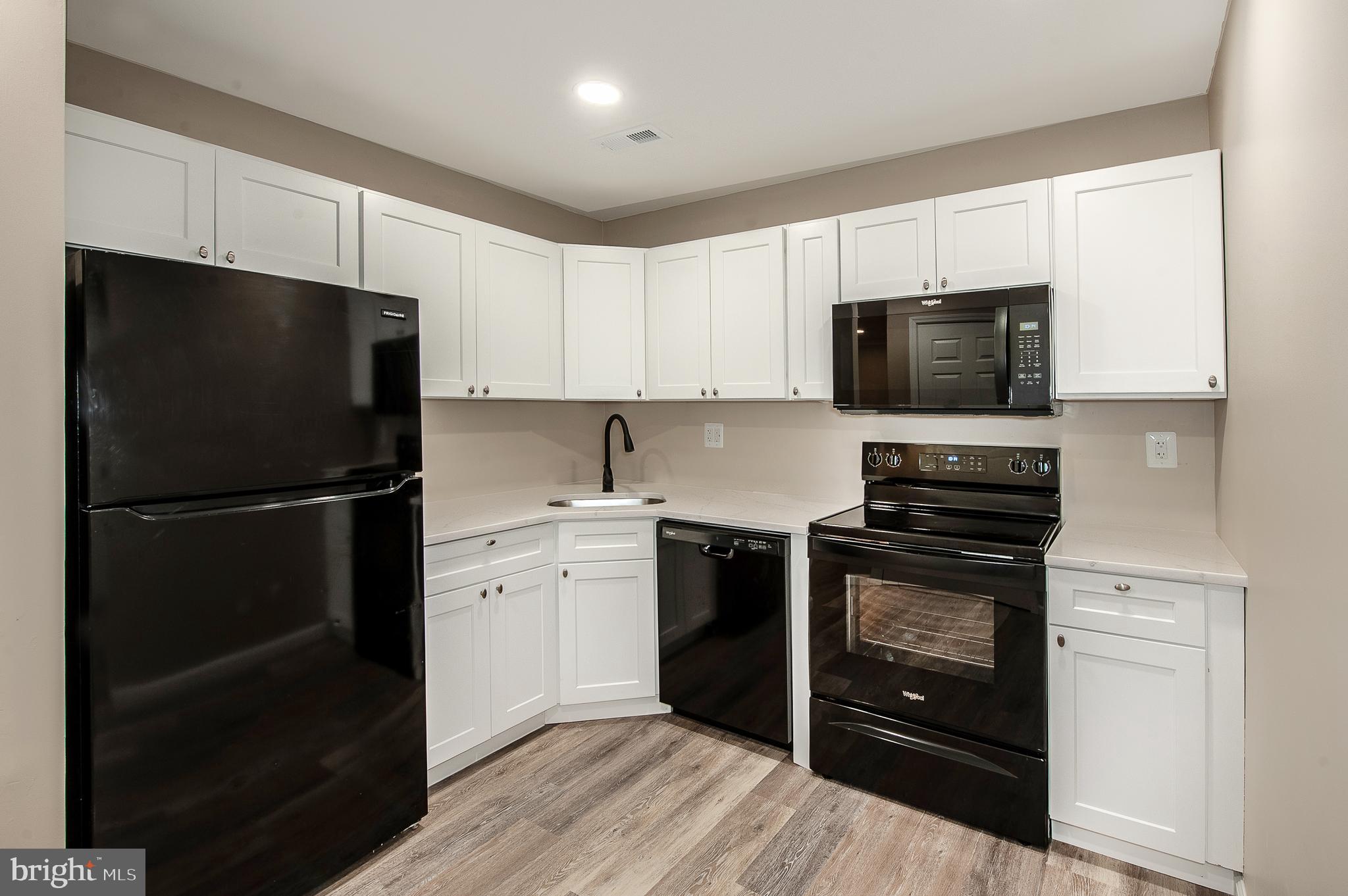 1010 Huntingdon Mews Clementon, NJ 08021 - Photo 9 of 19 a kitchen with a refrigerator stove and microwave
