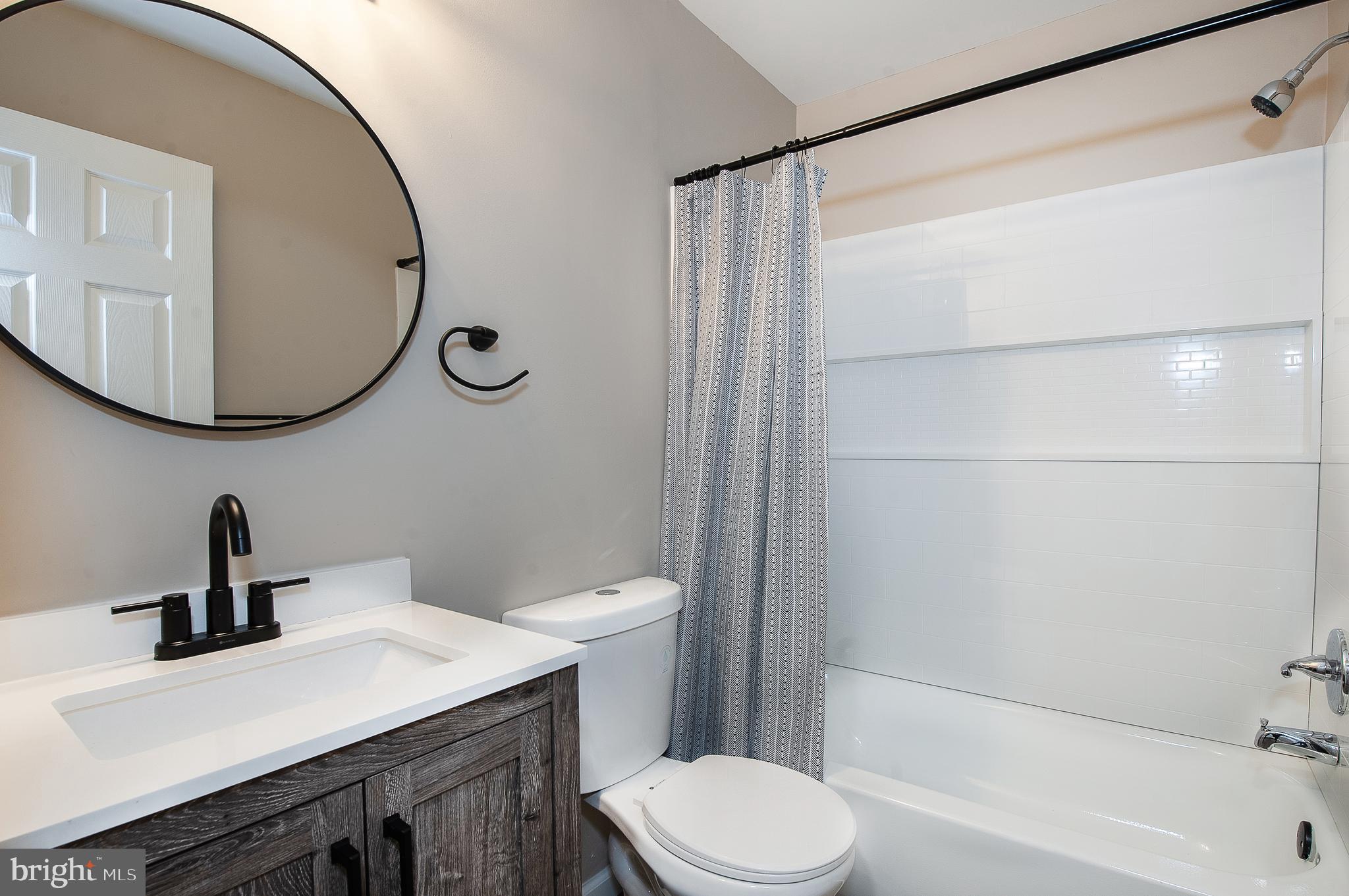 1010 Huntingdon Mews Clementon, NJ 08021 - Photo 10 of 19 a bathroom with a sink a toilet and a mirror