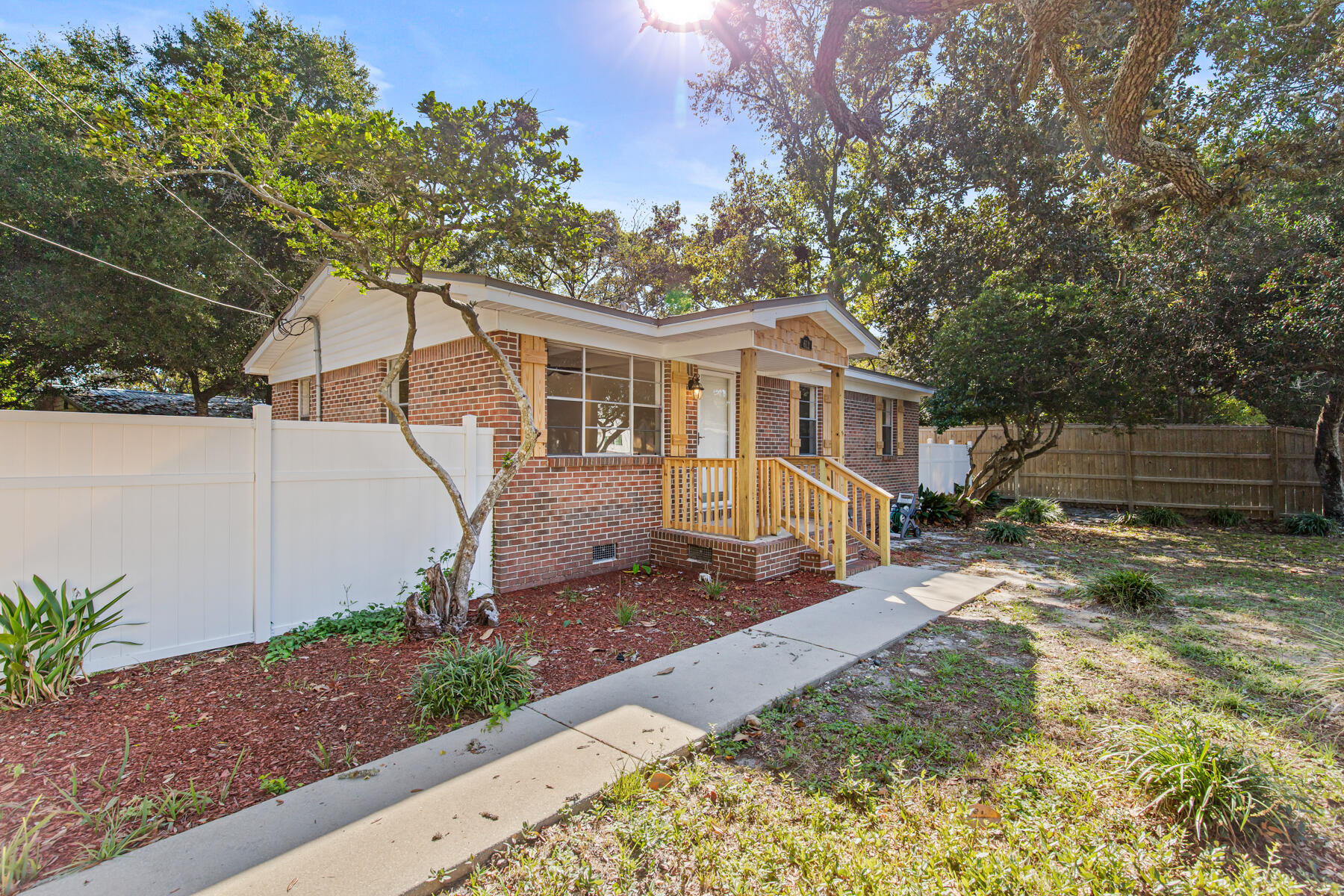 a front view of a house with a yard and a garage