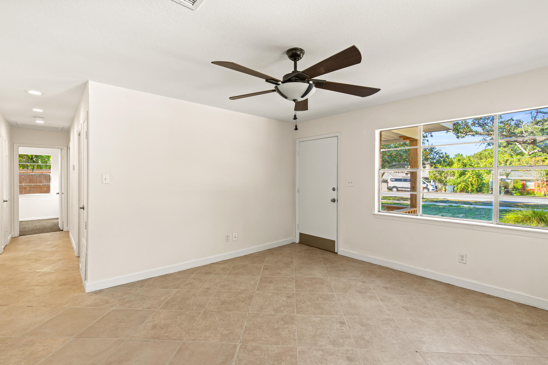 612 Beach Drive Destin, FL 32541 - Photo 14 of 34 an empty room with windows and entrance