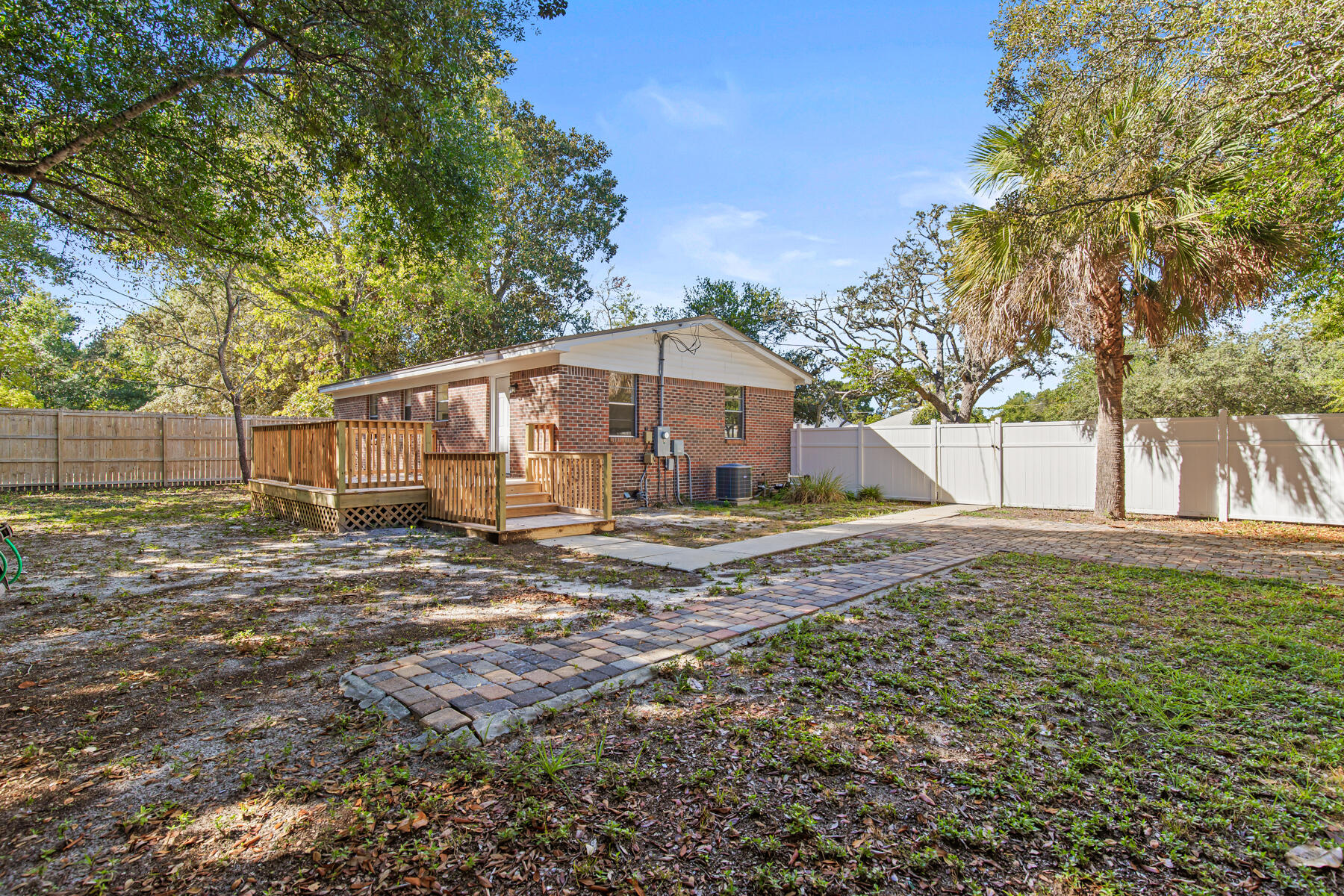 612 Beach Drive Destin, FL 32541 - Photo 22 of 34 a view of a house with backyard and tree