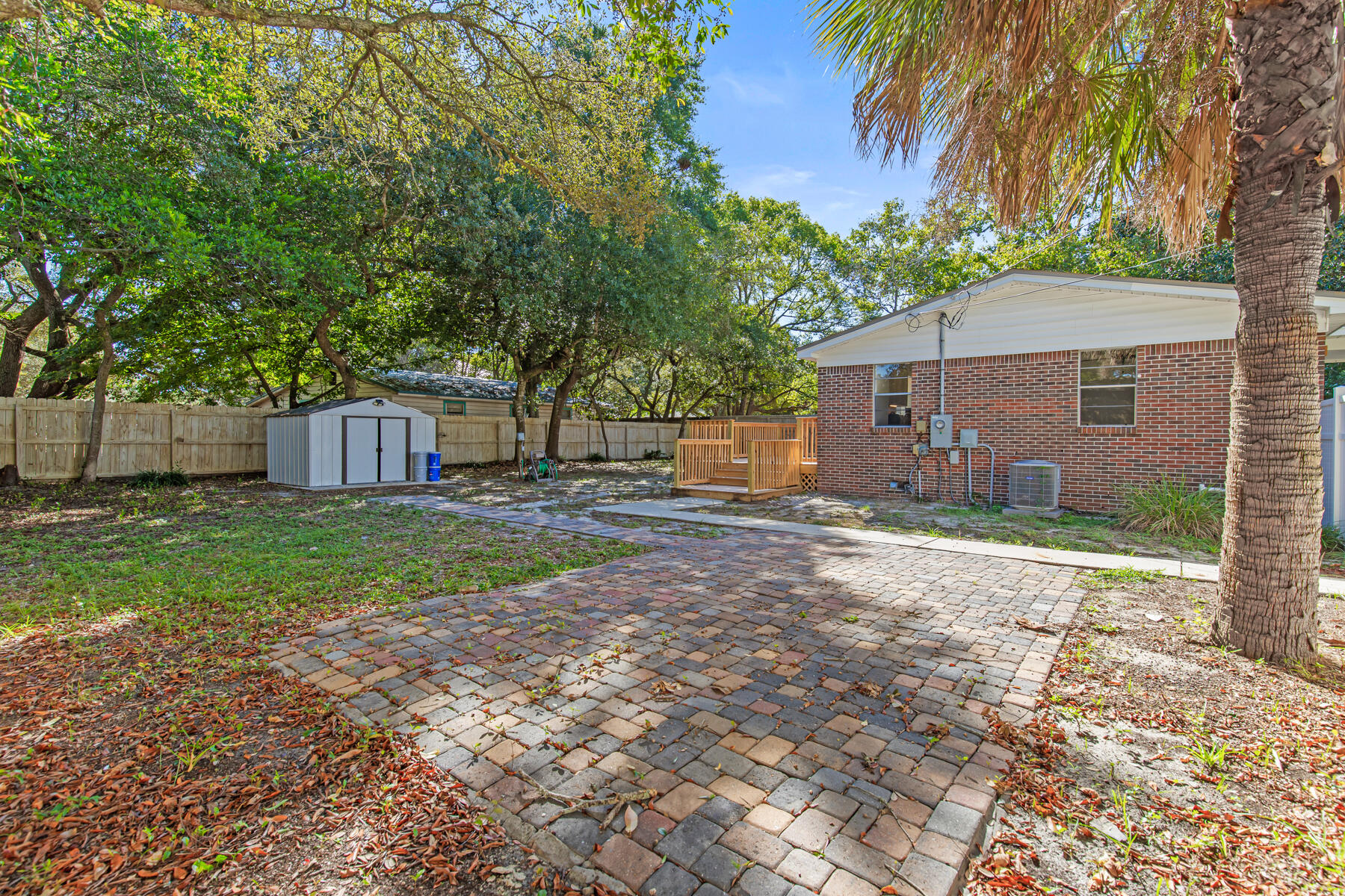612 Beach Drive Destin, FL 32541 - Photo 25 of 34 a view of a house with a yard