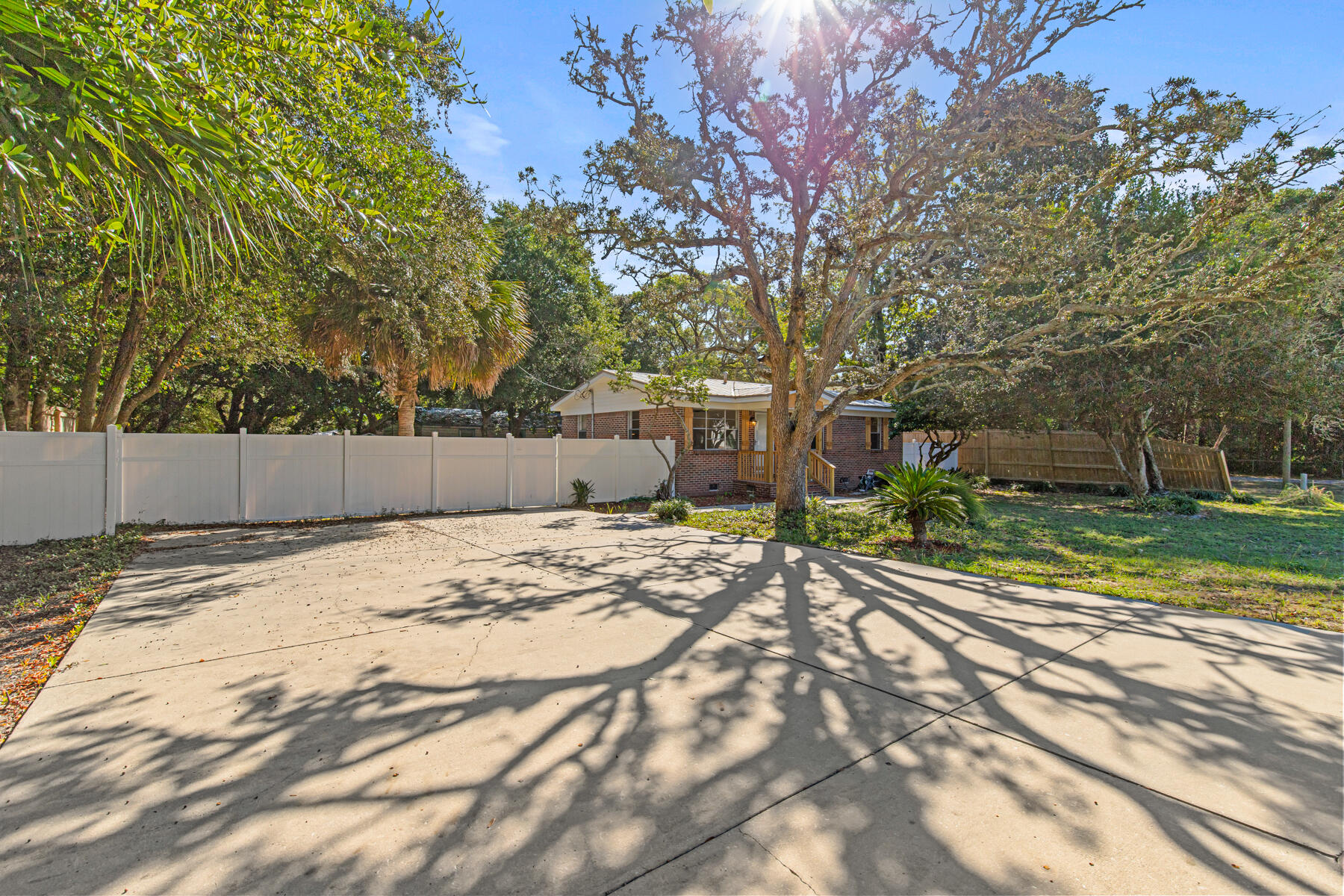 612 Beach Drive Destin, FL 32541 - Photo 6 of 34 a backyard of a house