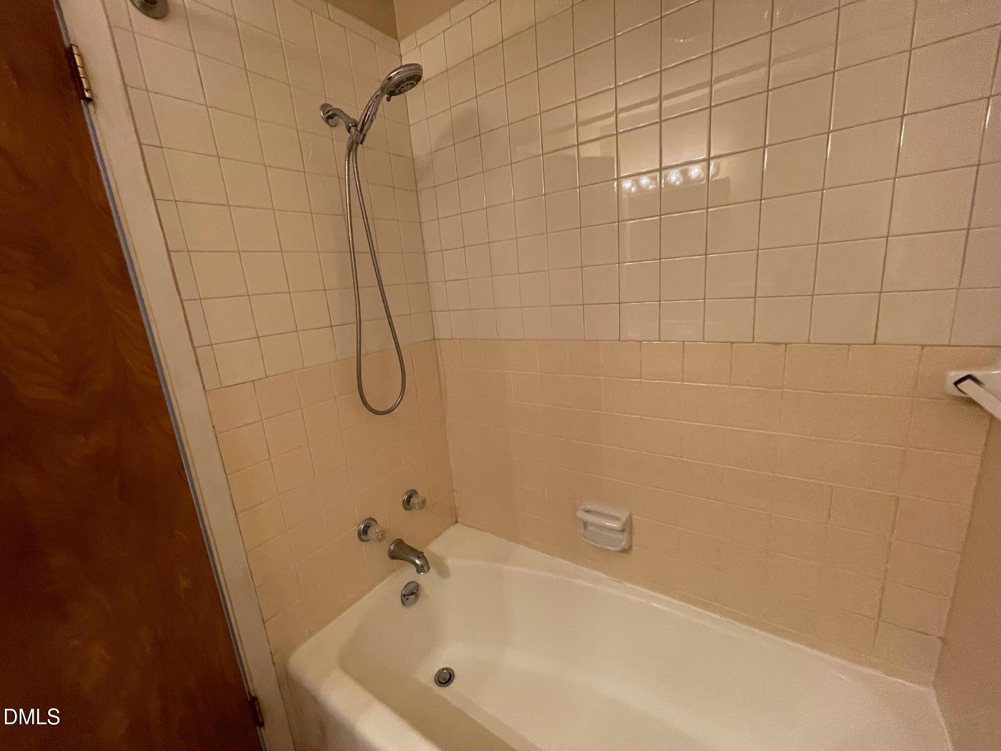 280 Montague Road Angier, NC 27501 - Photo 12 of 28 a bathroom with a bath tub with a shower