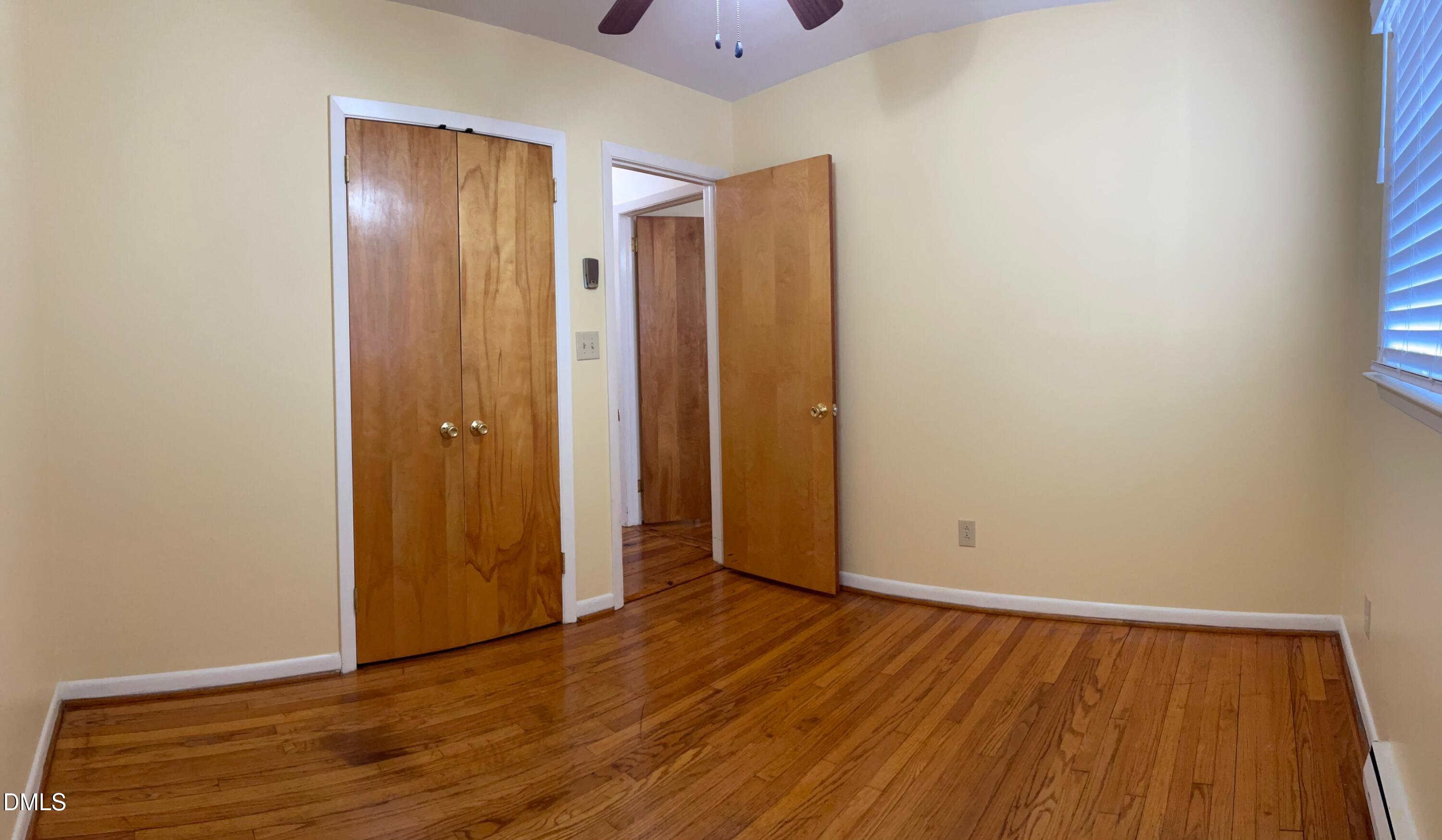 280 Montague Road Angier, NC 27501 - Photo 16 of 28 an empty room with wooden floor and windows