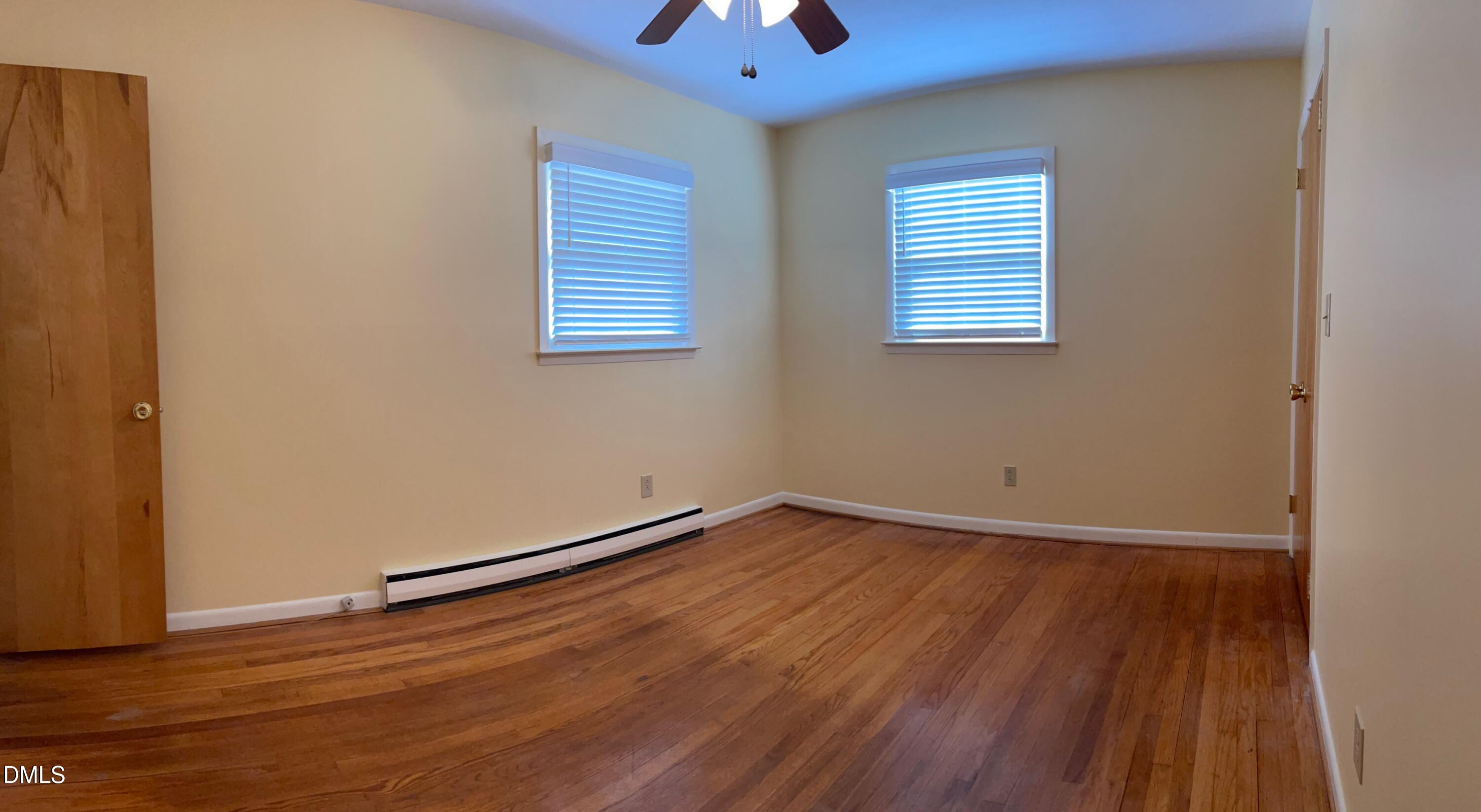 280 Montague Road Angier, NC 27501 - Photo 17 of 28 an empty room with wooden floor and windows
