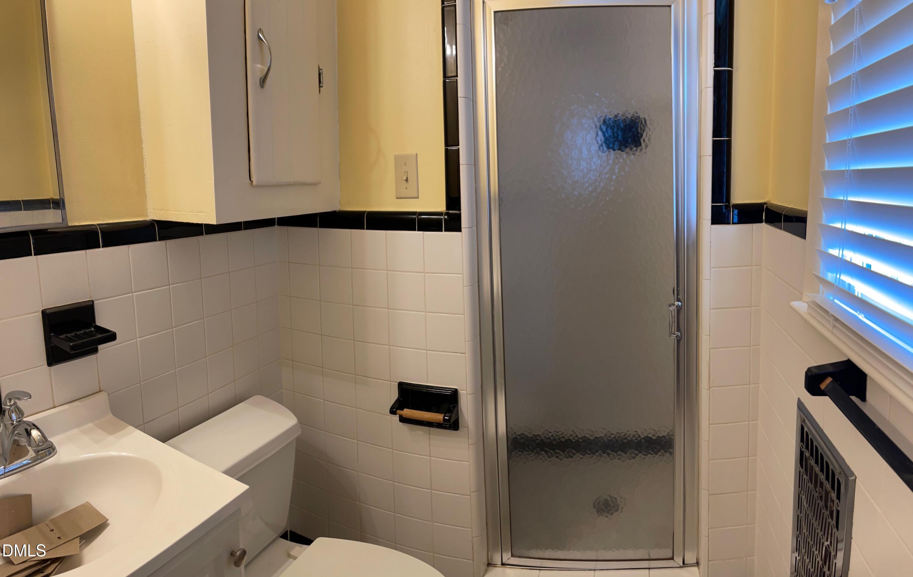 280 Montague Road Angier, NC 27501 - Photo 20 of 28 a bathroom with a sink and a mirror