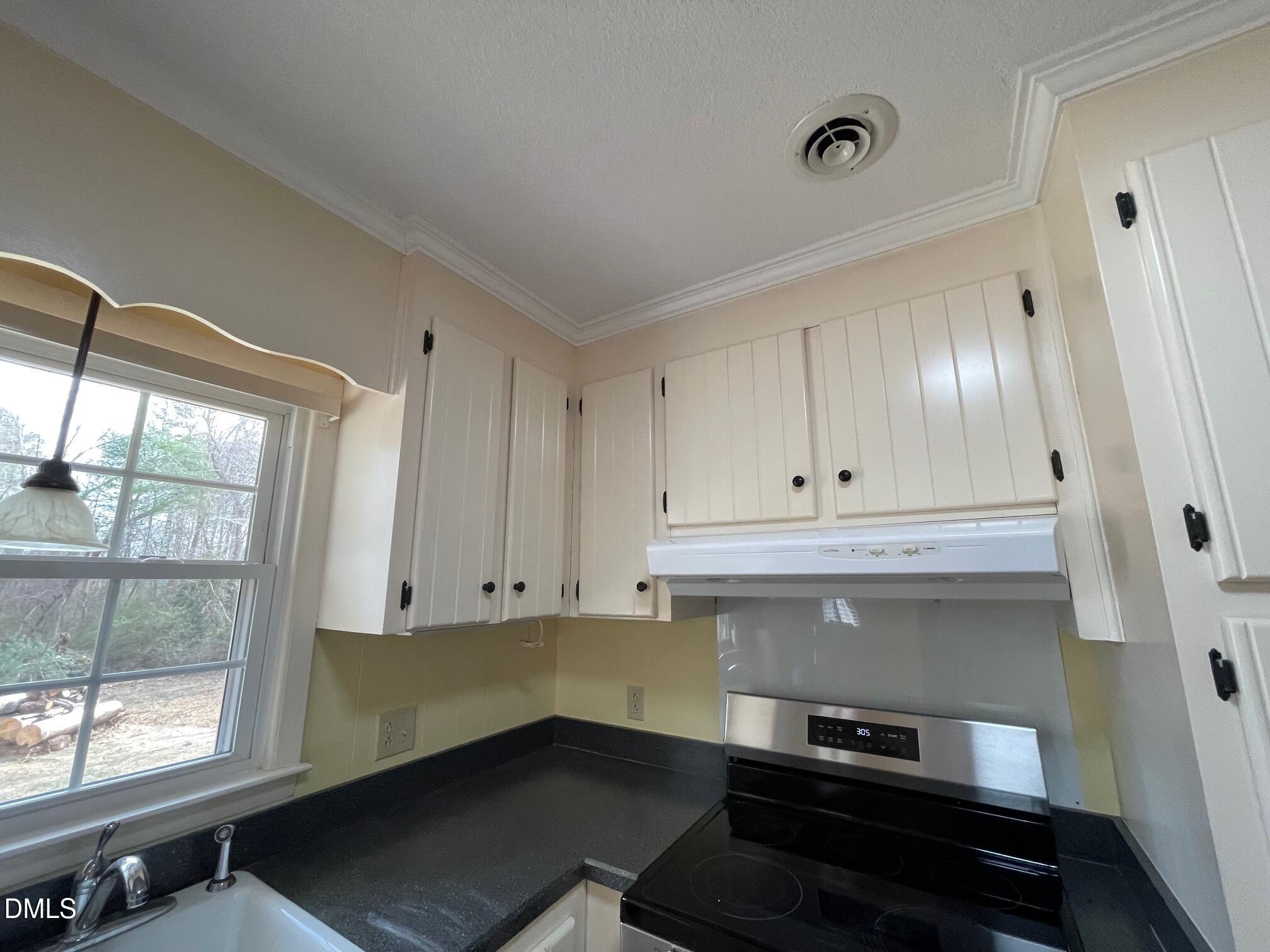 280 Montague Road Angier, NC 27501 - Photo 25 of 28 a view of kitchen with wooden floor and electronic appliances